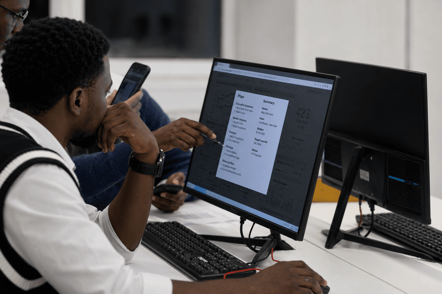 Students collaborating around a screen during a technology training session